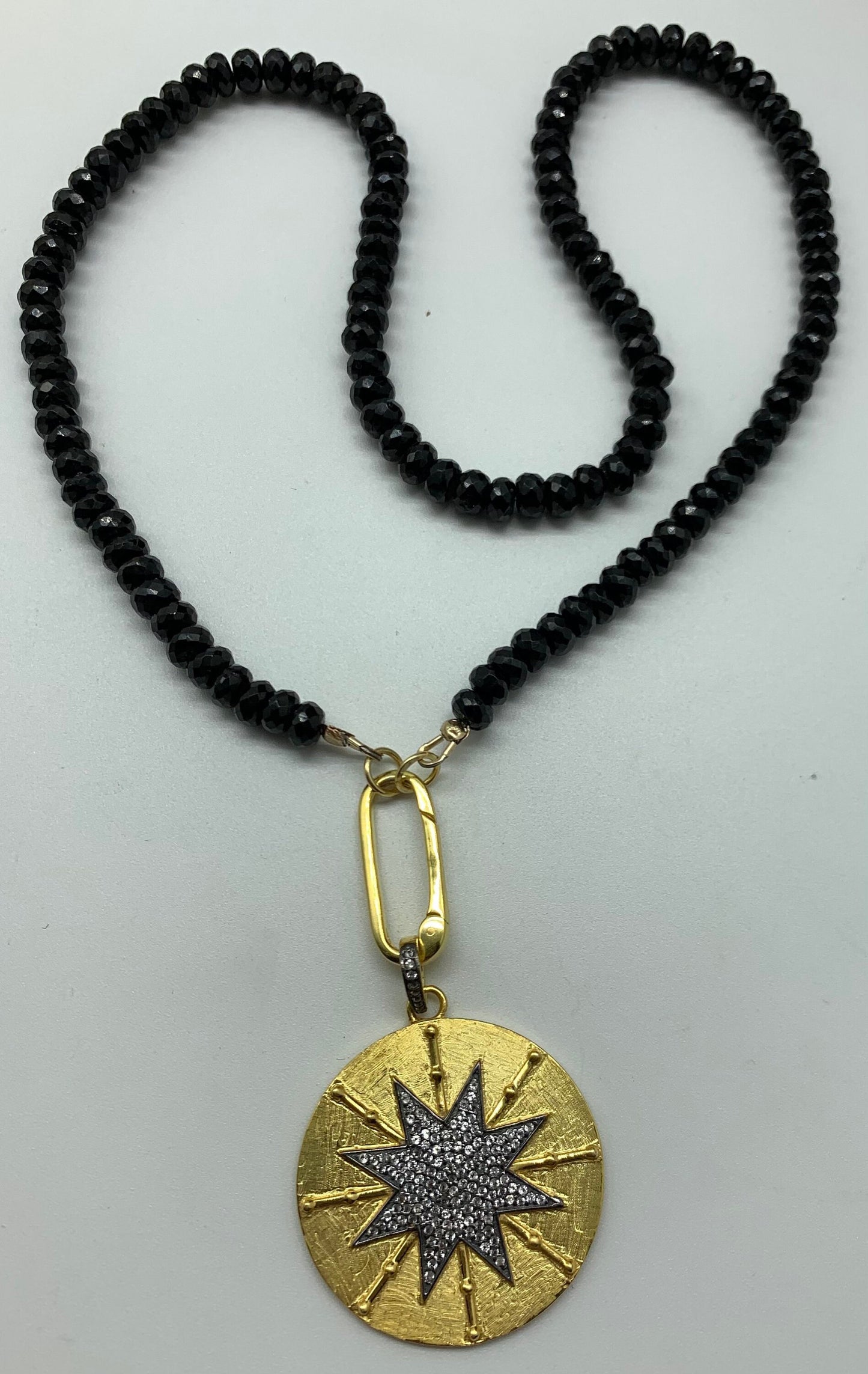 Black spinal white topaz vermeil charm necklace